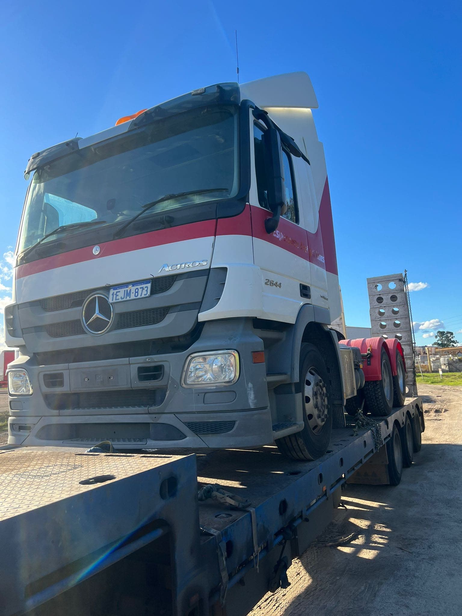 Mercedes Actros prime mover chained on a low loader