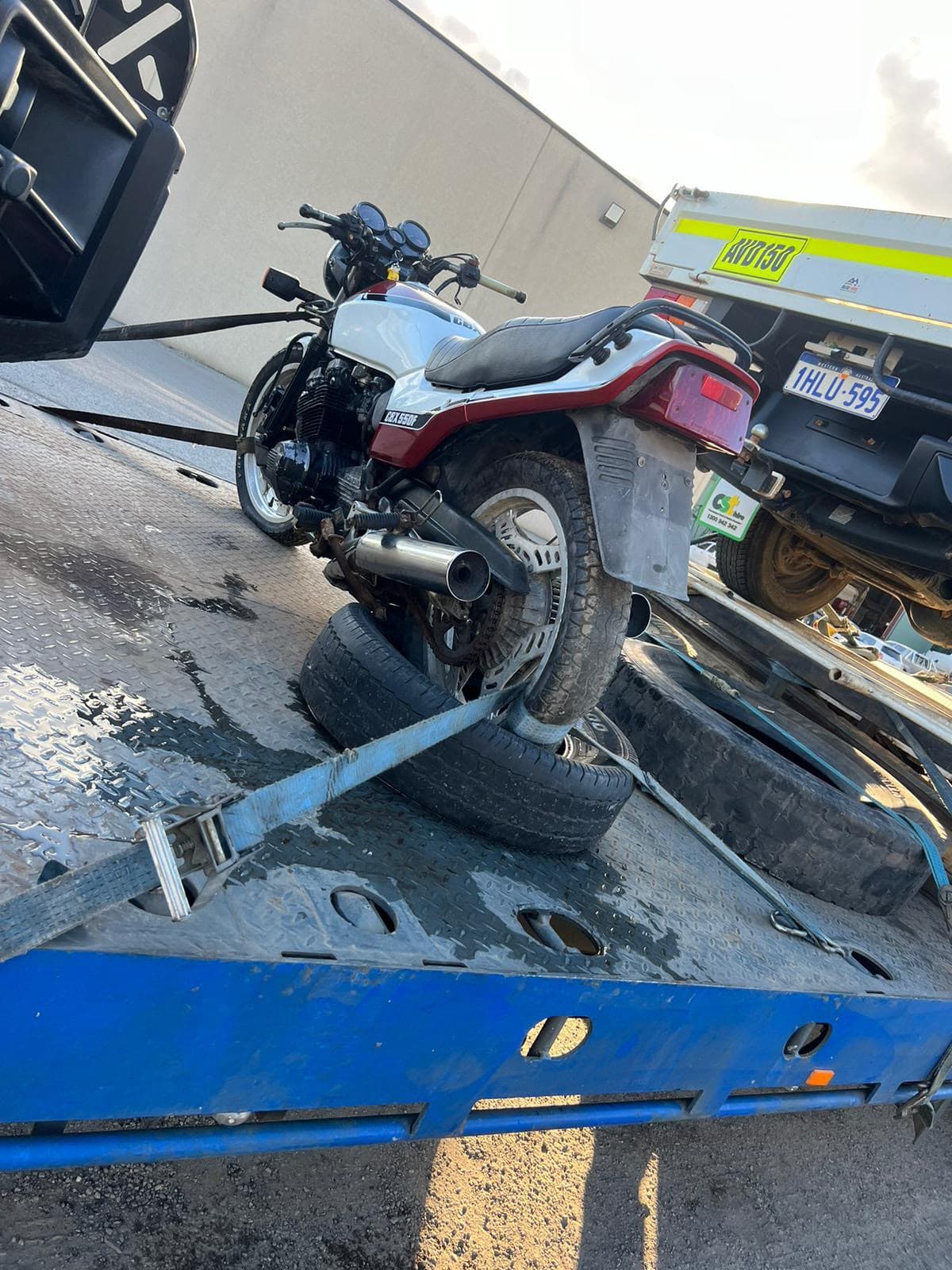 Classic motorbike strapped on a GNDJ flatbed